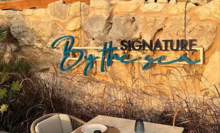 Signature by the Sea